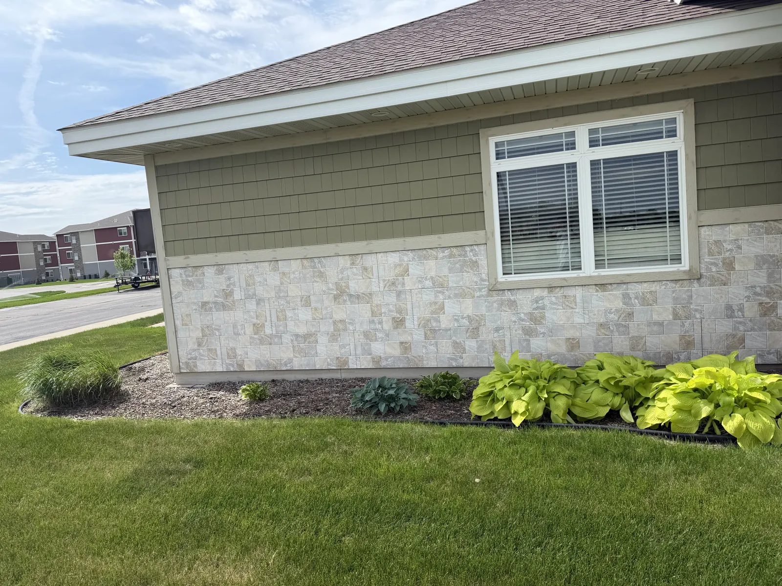 Cleanly edged landscaping beside a residential property